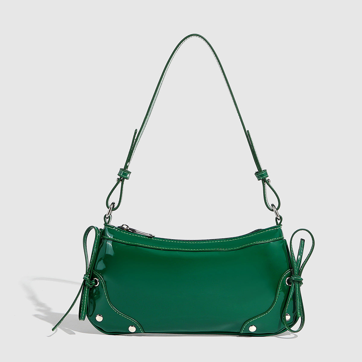 Glossy shoulder bag with side ties