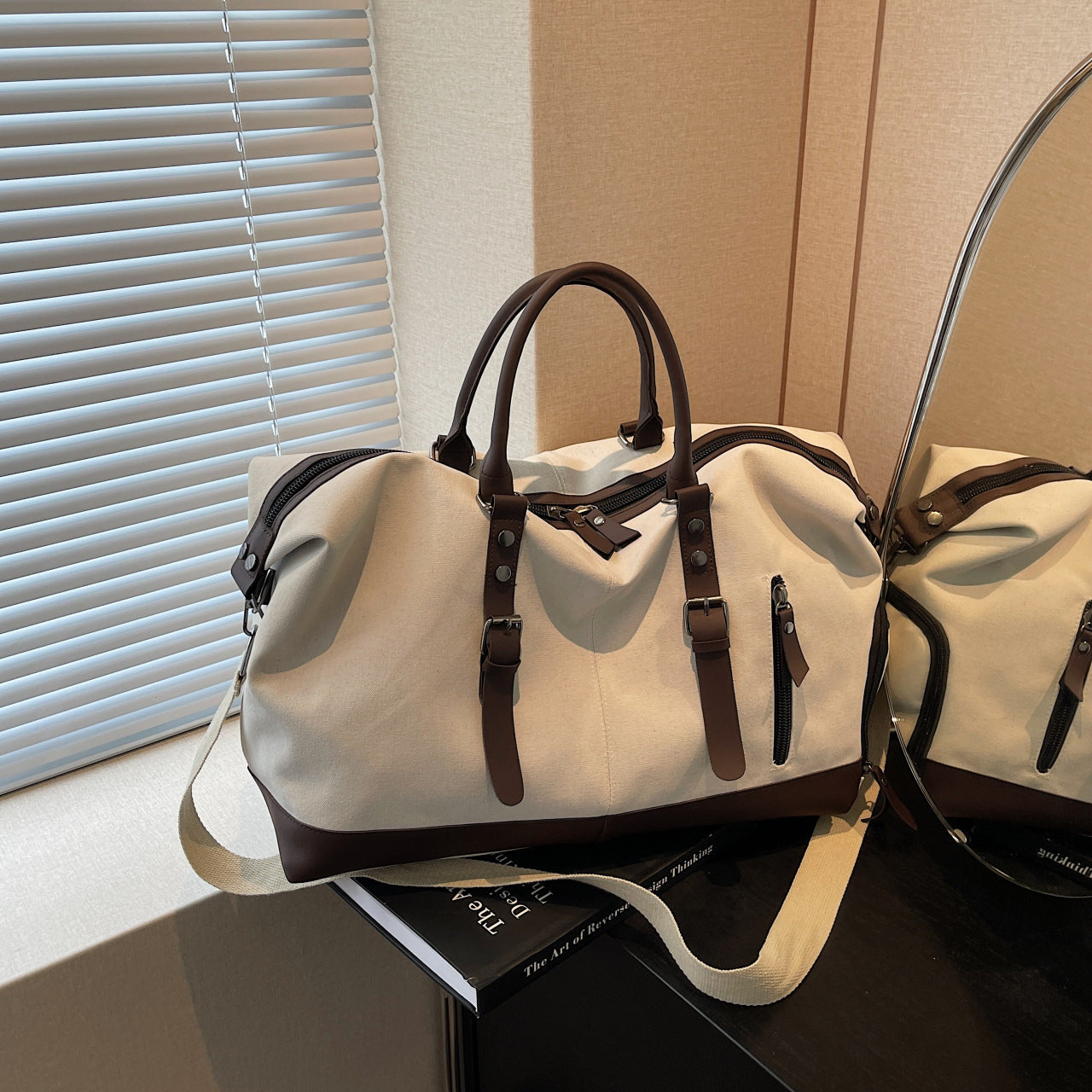 Canvas duffel bag with leather accents