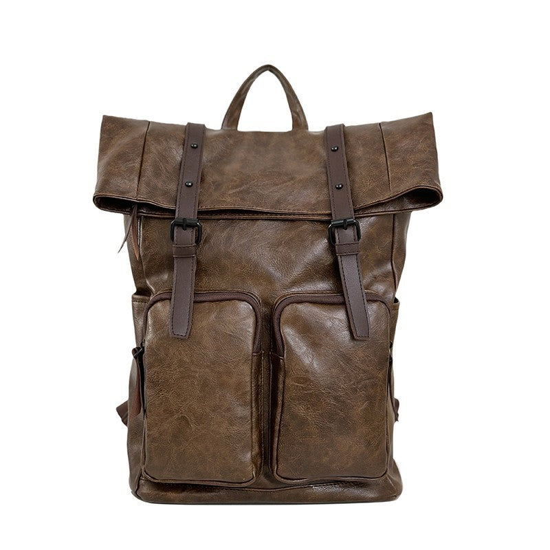 Fold-over flap backpack with front pocket