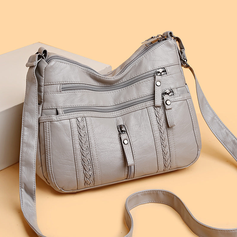 Multi-pocket shoulder bag with zipper closure