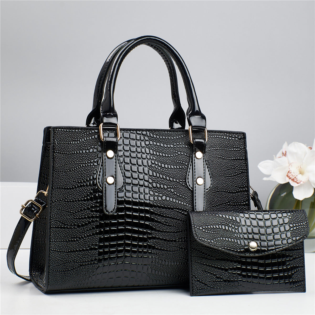 Embossed handbag with matching pouch