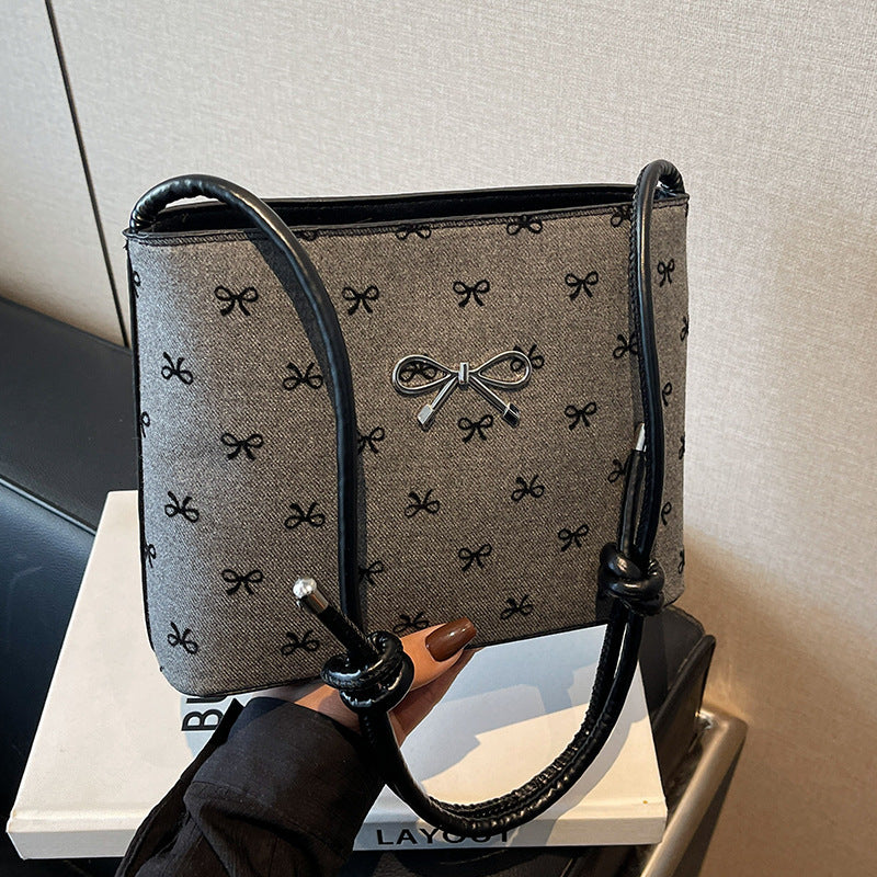 Structured handbag with perforated surface