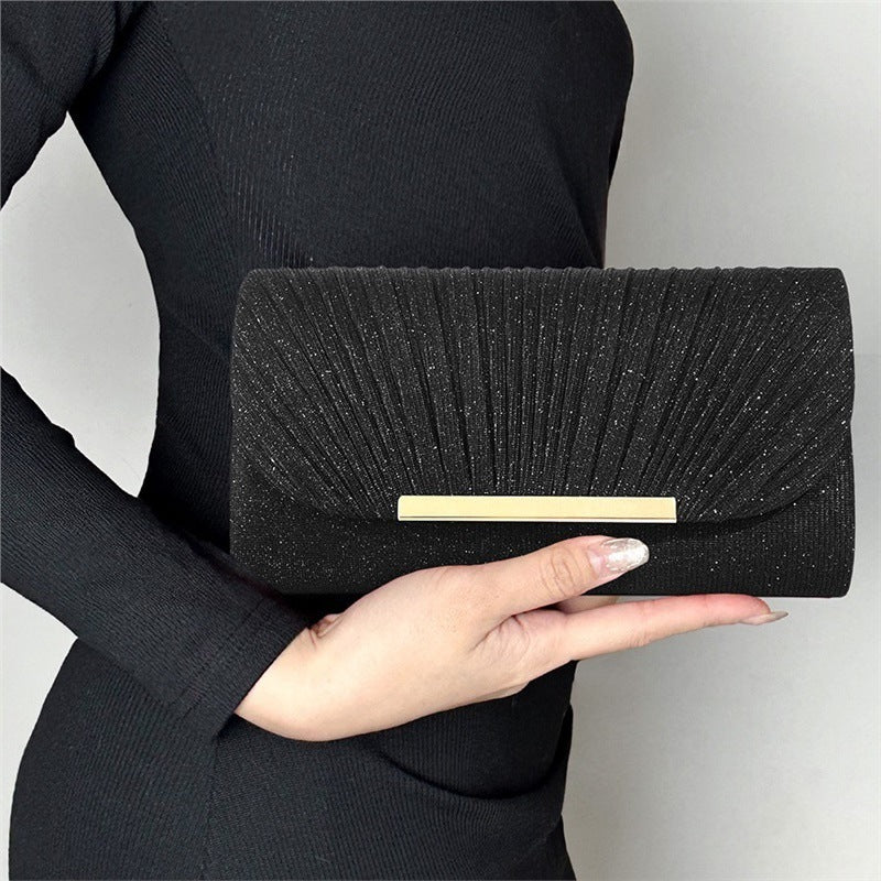 Pleated clutch bag with metallic accent