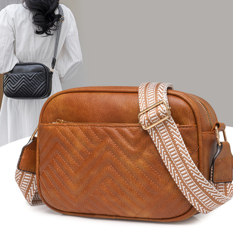 Quilted crossbody bag with front pocket