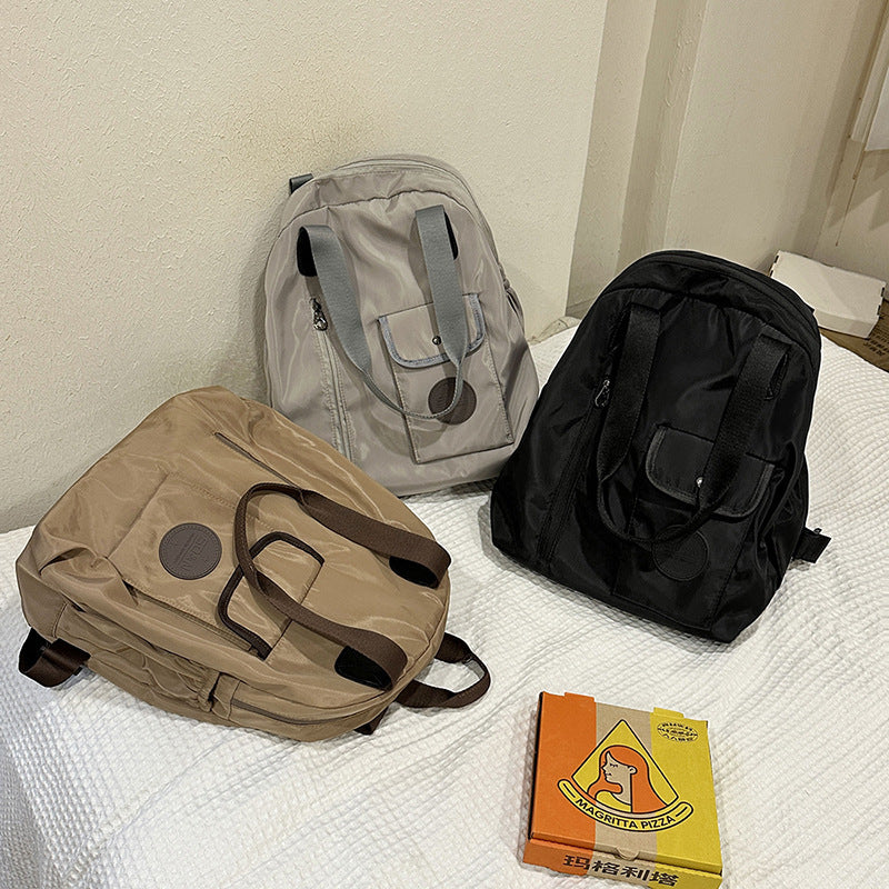 Soft backpack with flap and drawstring closure