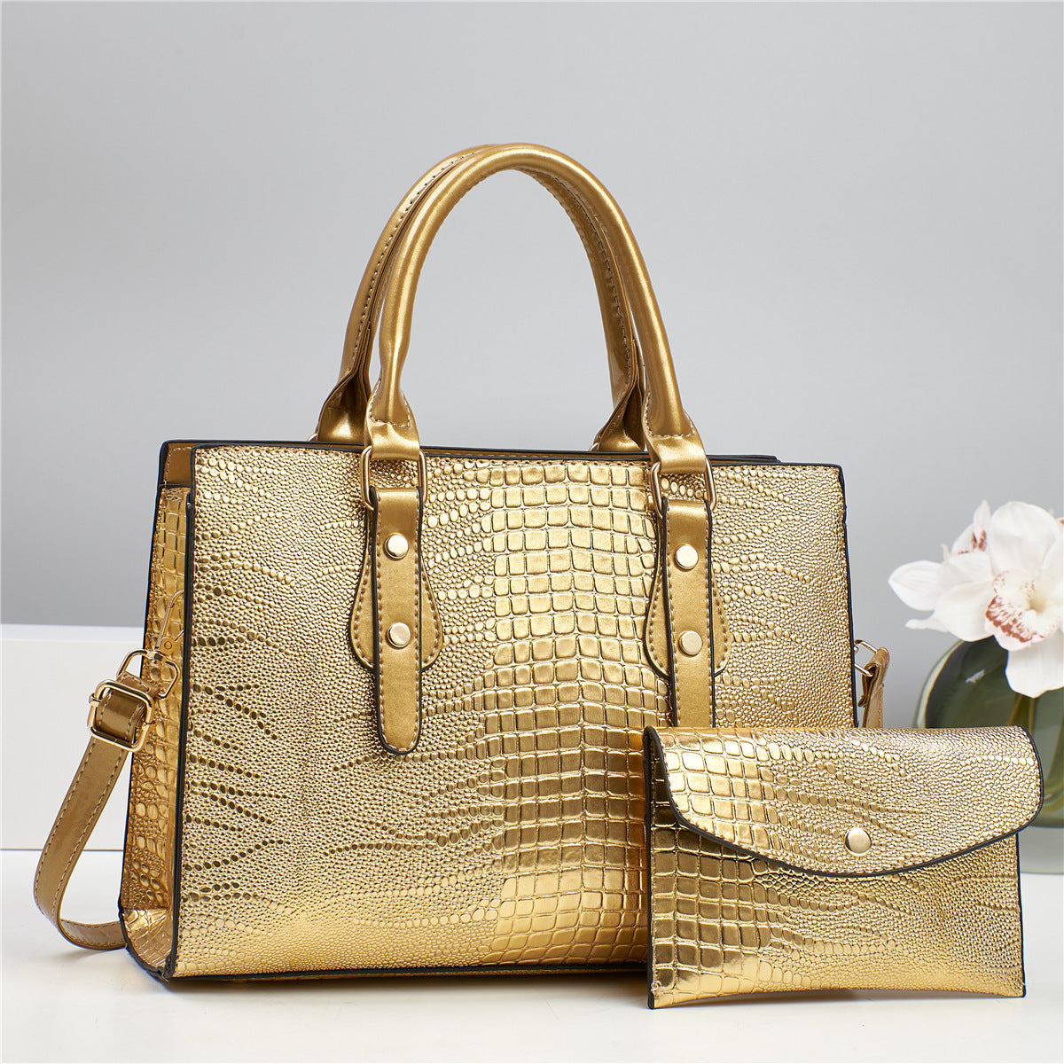 Embossed handbag with matching pouch