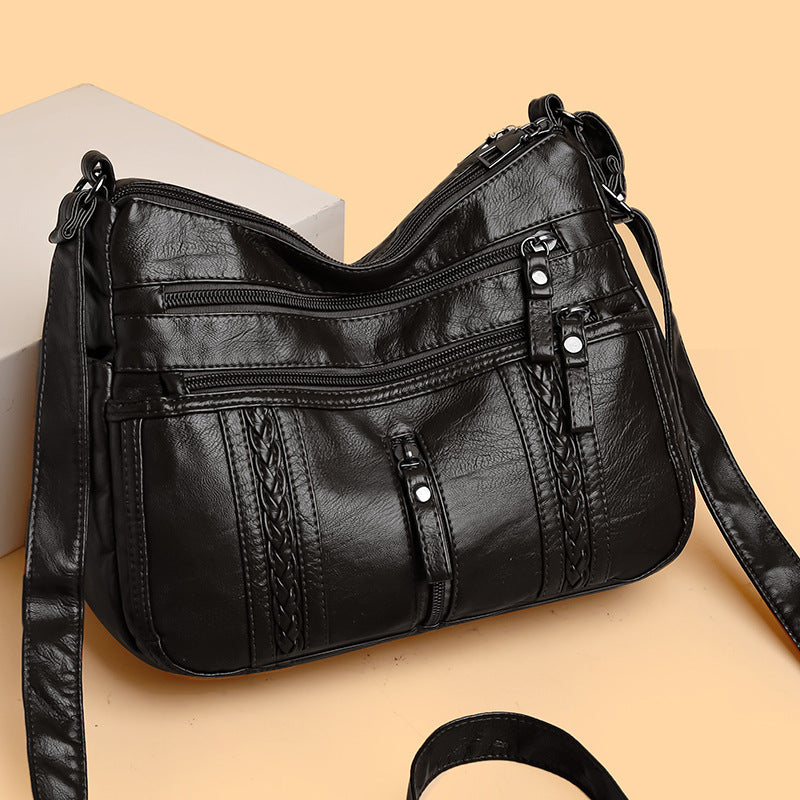 Multi-pocket shoulder bag with zipper closure