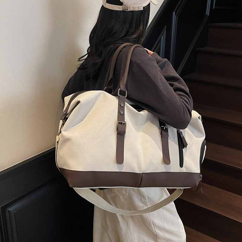 Canvas duffel bag with leather accents