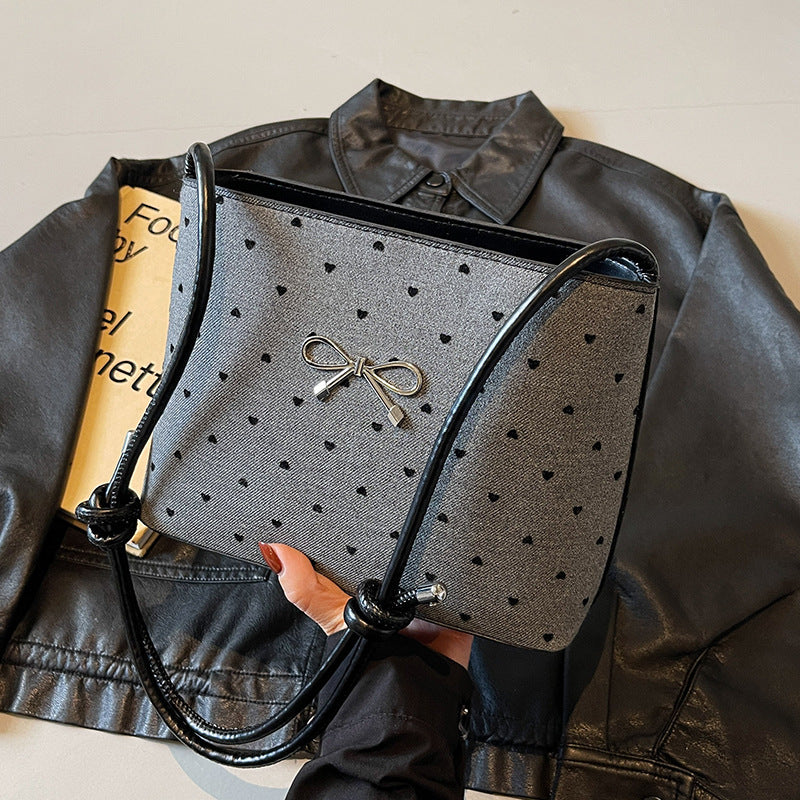 Structured handbag with perforated surface