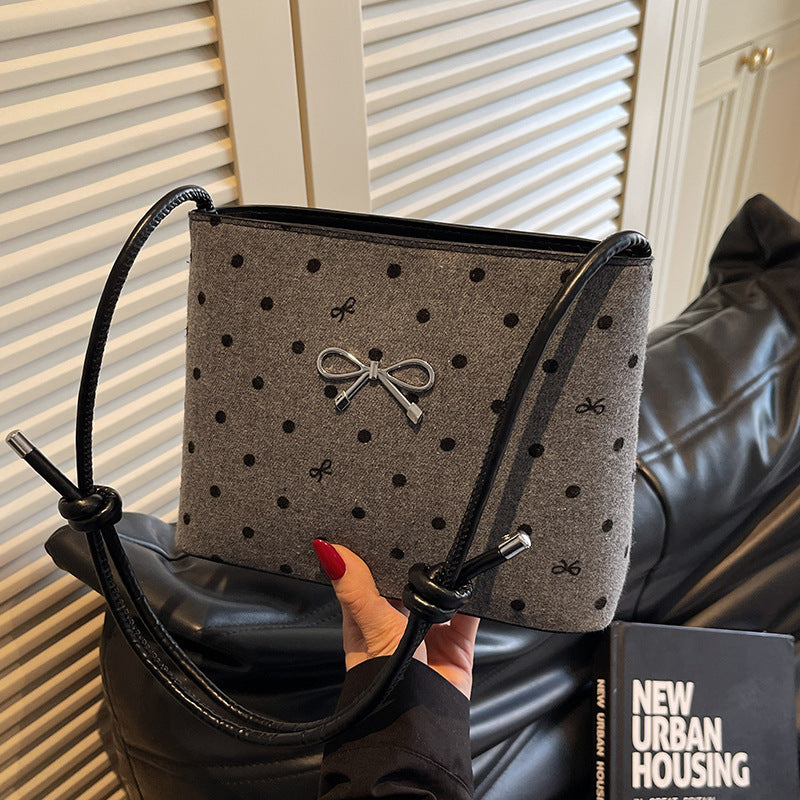 Structured handbag with perforated surface