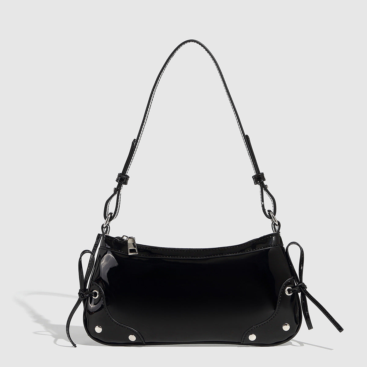 Glossy shoulder bag with side ties