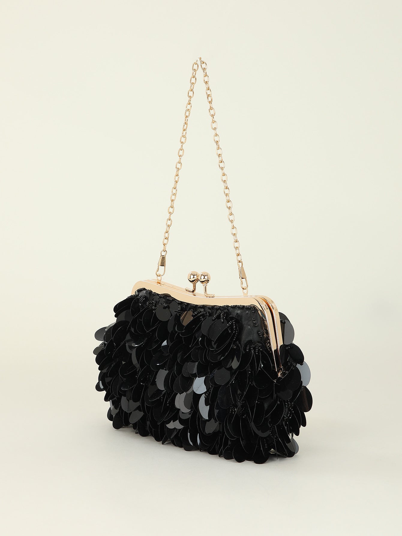 Sequined clutch bag with chain strap