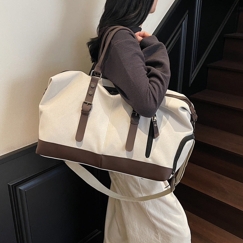 Canvas duffel bag with leather accents