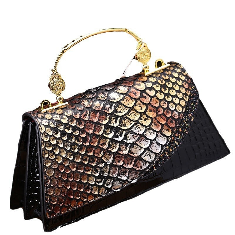 Structured handbag with metallic handle