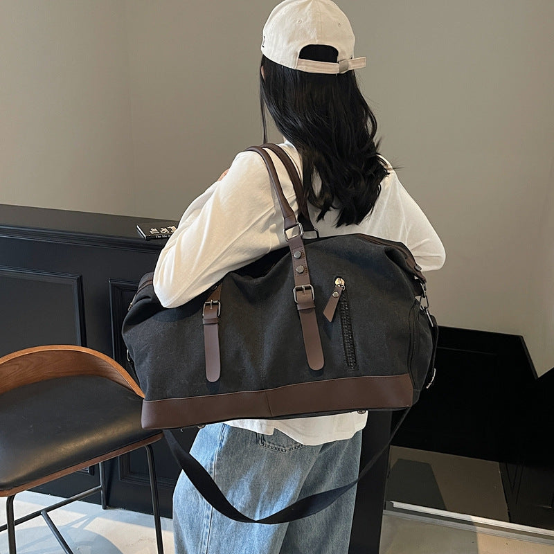Canvas duffel bag with leather accents