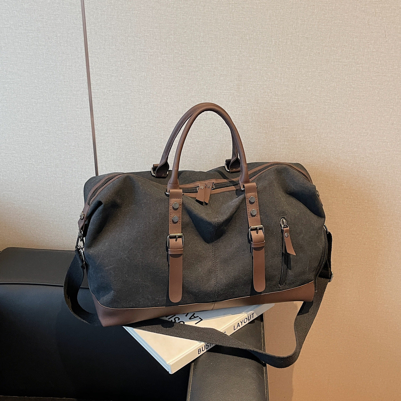 Canvas duffel bag with leather accents