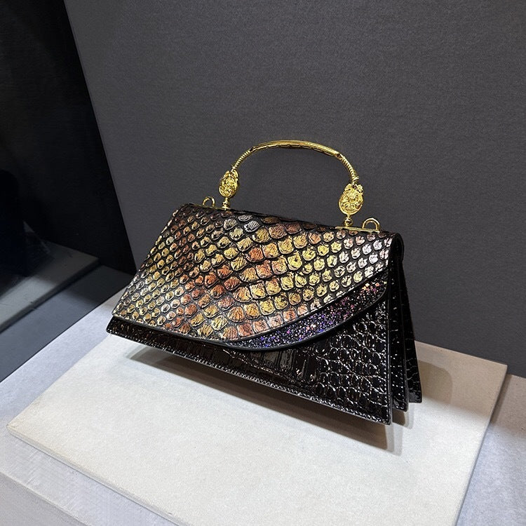 Structured handbag with metallic handle
