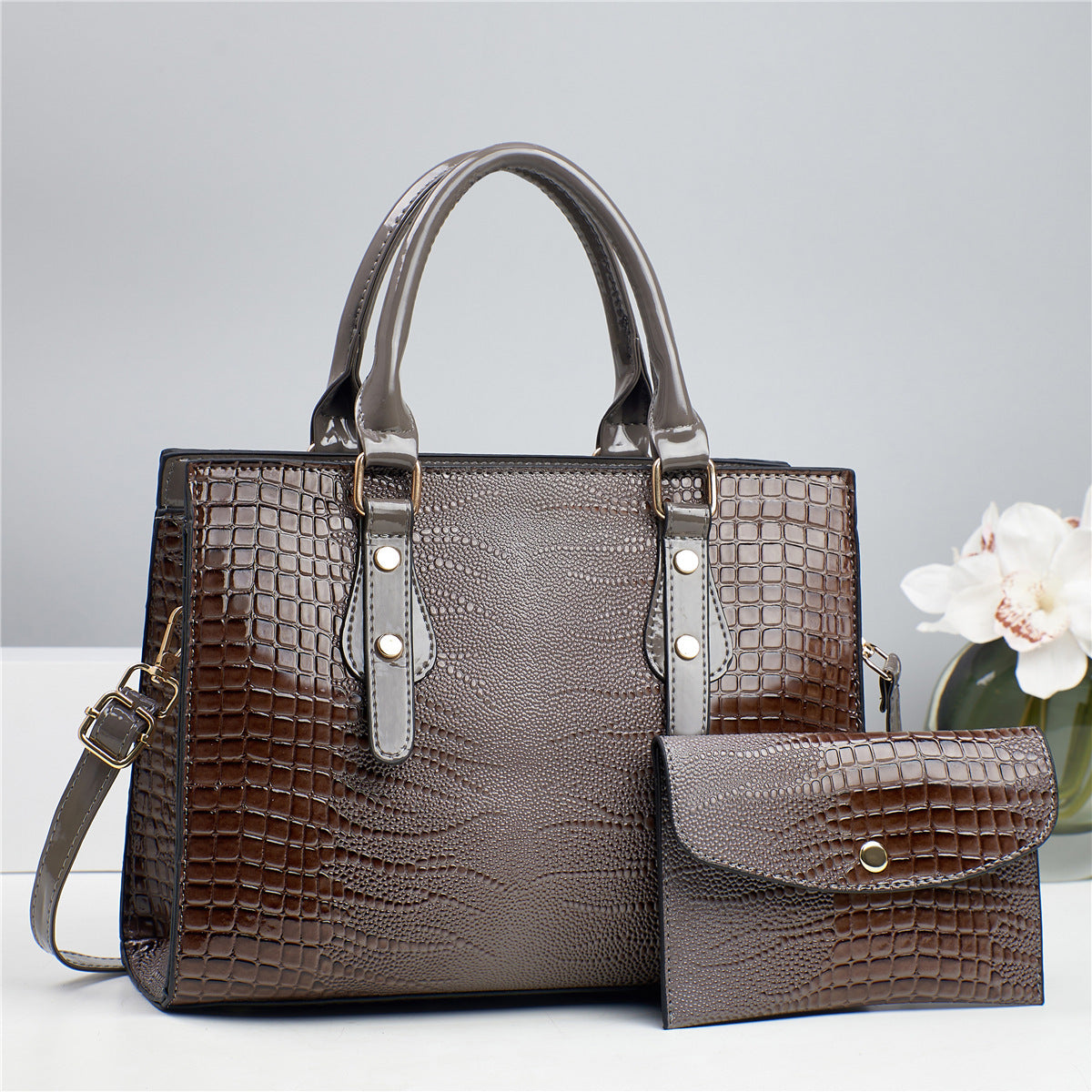 Embossed handbag with matching pouch