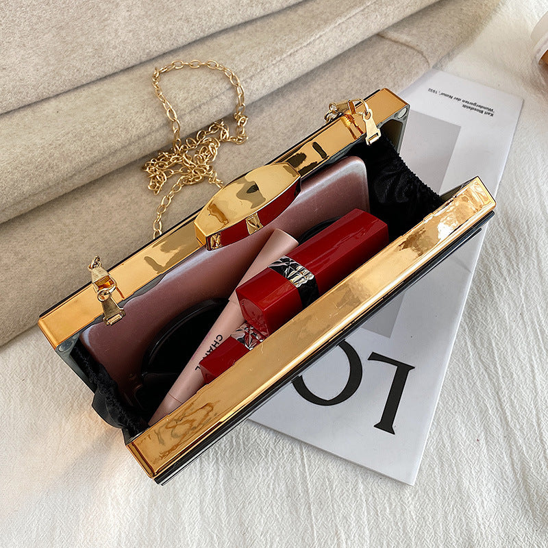 Rhinestone embellished clutch bag with chain strap