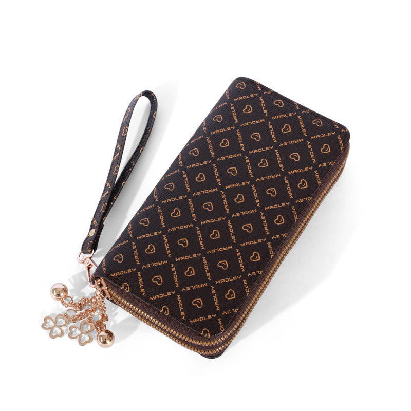 Patterned zip-around wallet with wrist strap