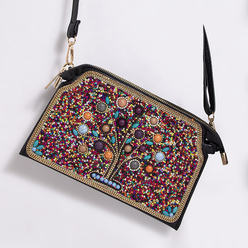Embroidered crossbody bag with embellishments