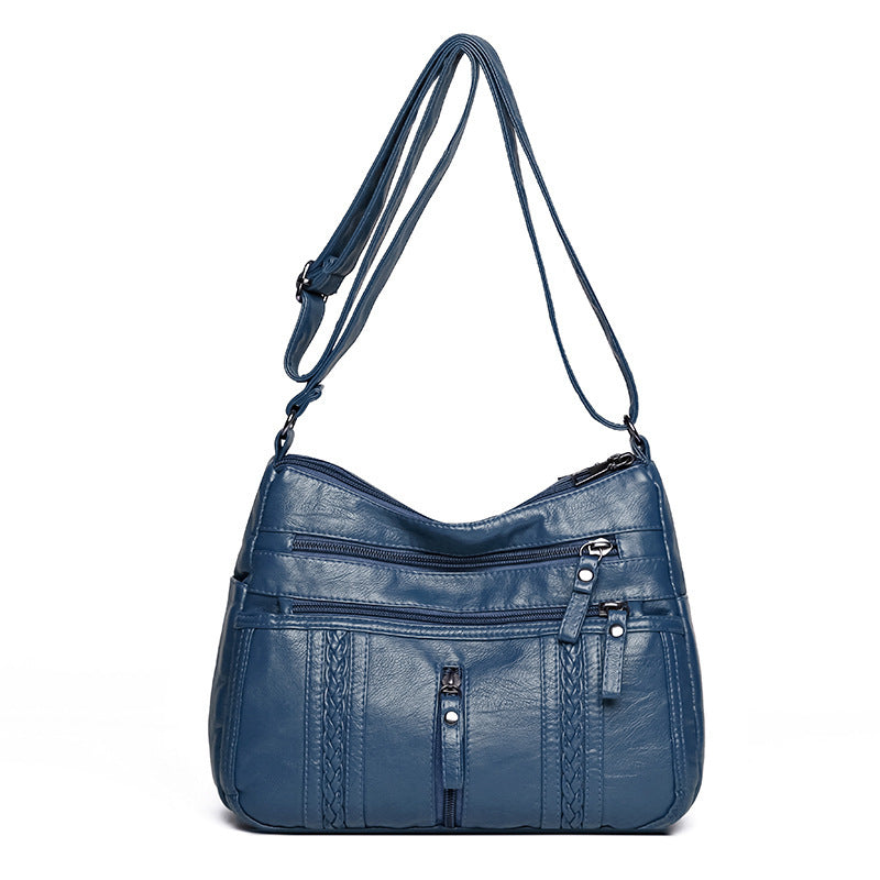 Multi-pocket shoulder bag with zipper closure