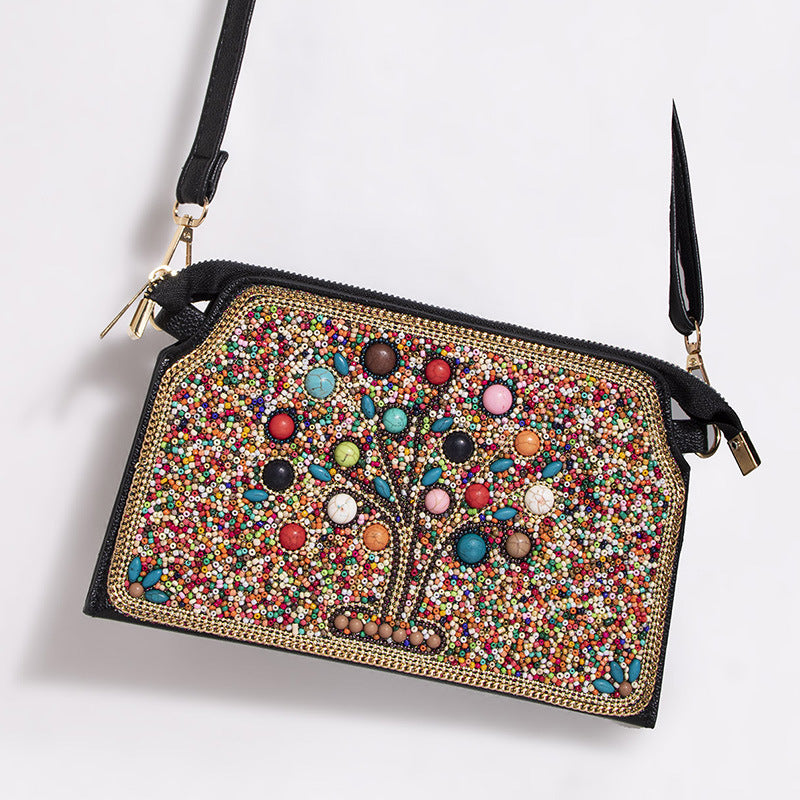 Embroidered crossbody bag with embellishments