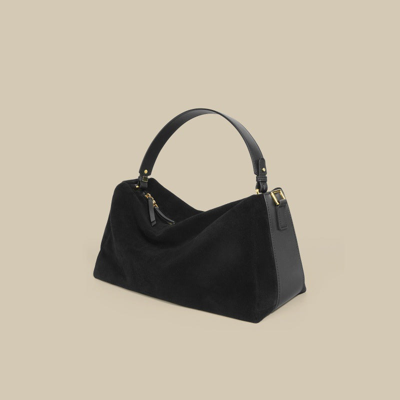 Triangular handbag with single handle