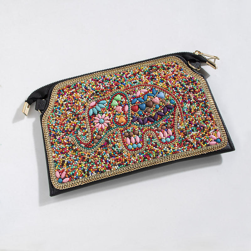 Embroidered crossbody bag with embellishments