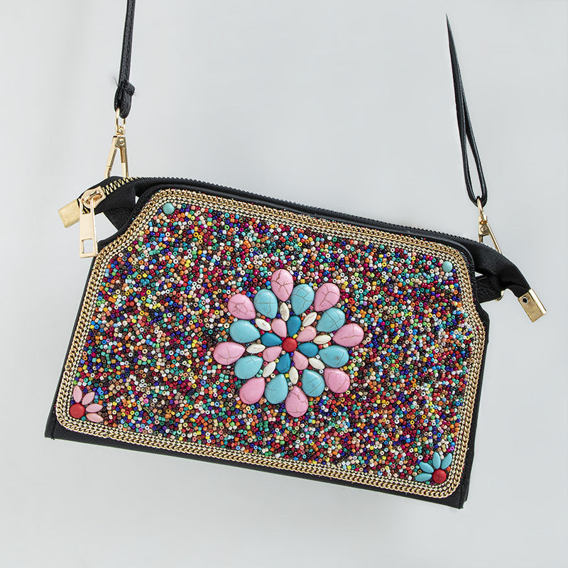 Embroidered crossbody bag with embellishments
