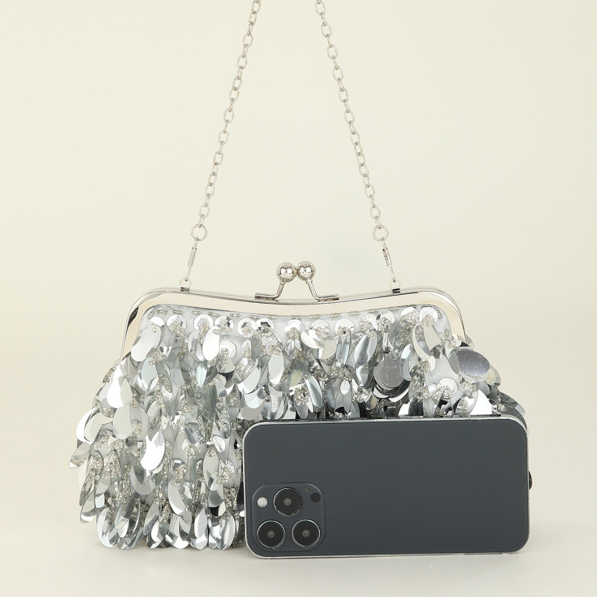 Sequined clutch bag with chain strap
