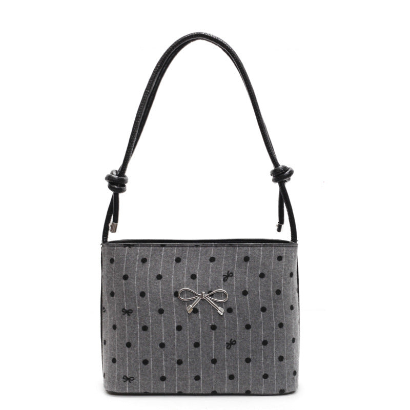 Structured handbag with perforated surface