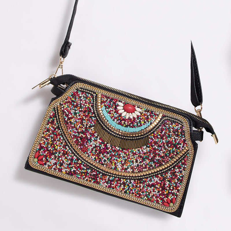 Embroidered crossbody bag with embellishments