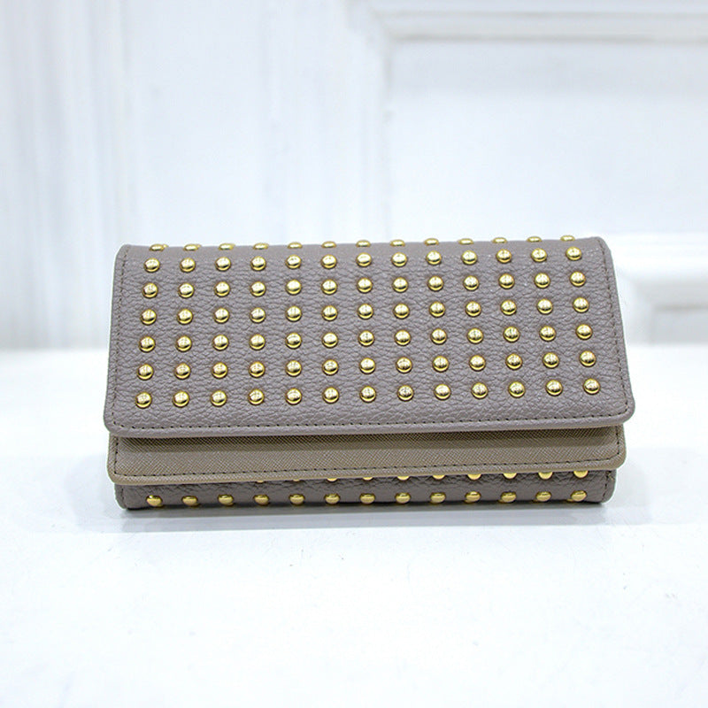Studded wallet with flap closure