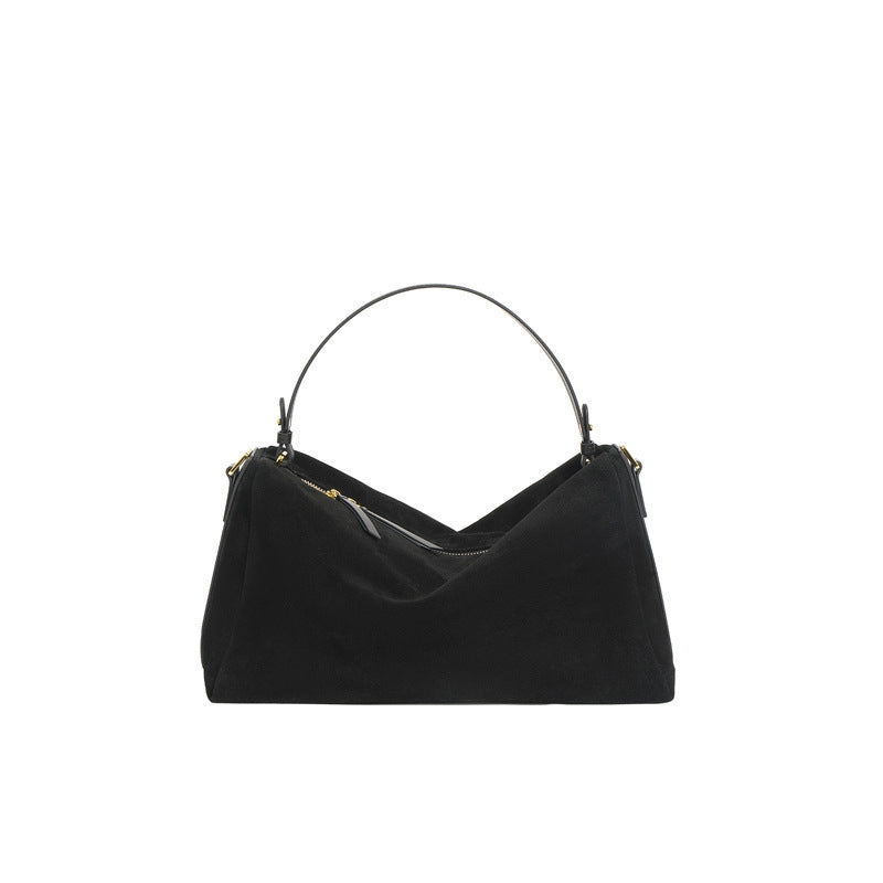 Triangular handbag with single handle