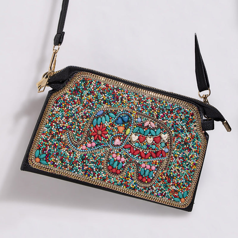 Embroidered crossbody bag with embellishments