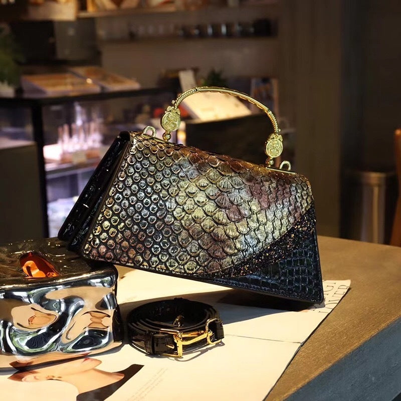 Structured handbag with metallic handle