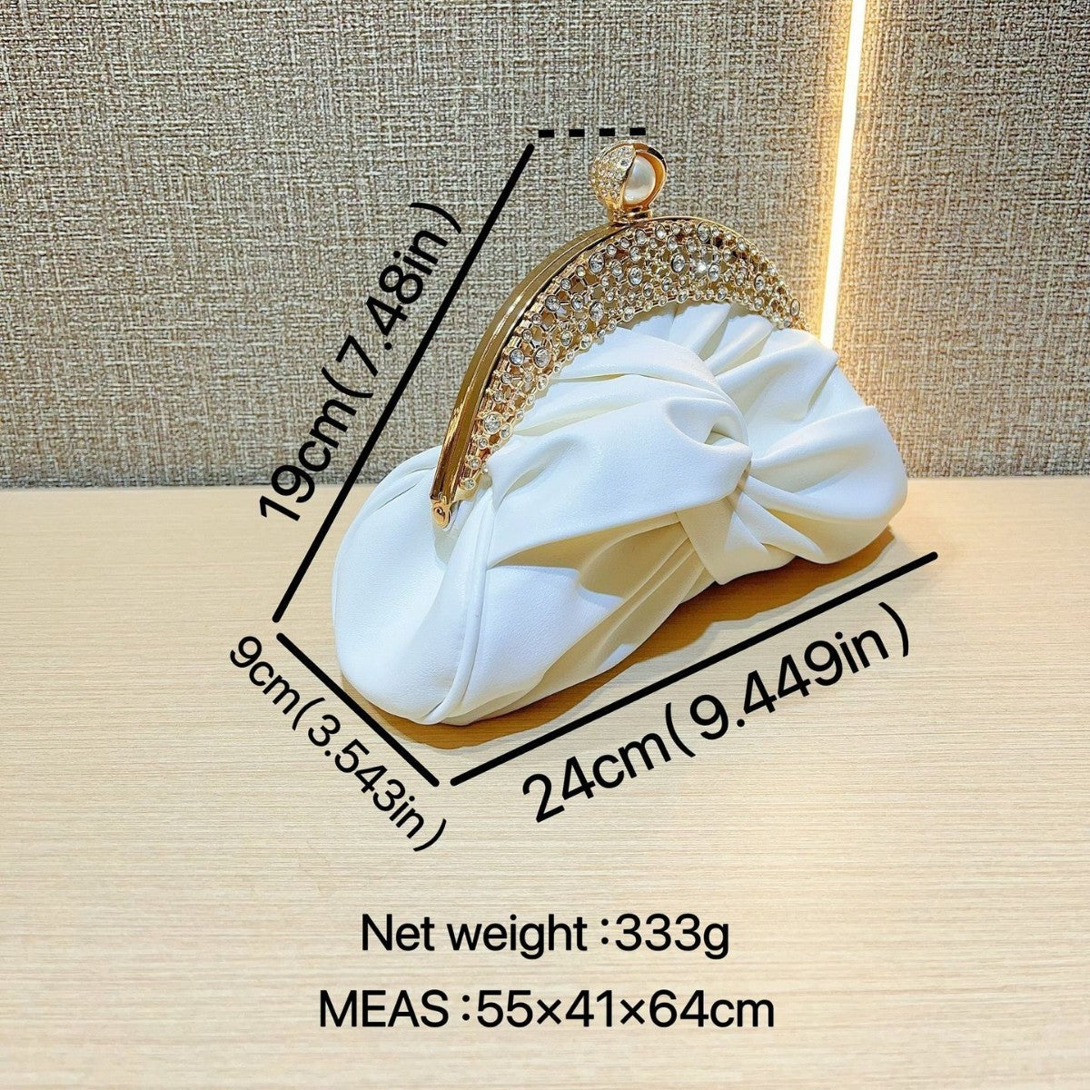 Satin clutch bag with metal frame
