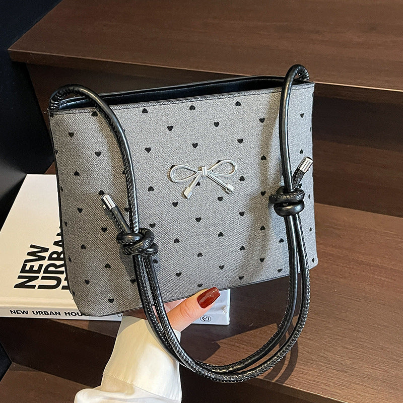 Structured handbag with perforated surface