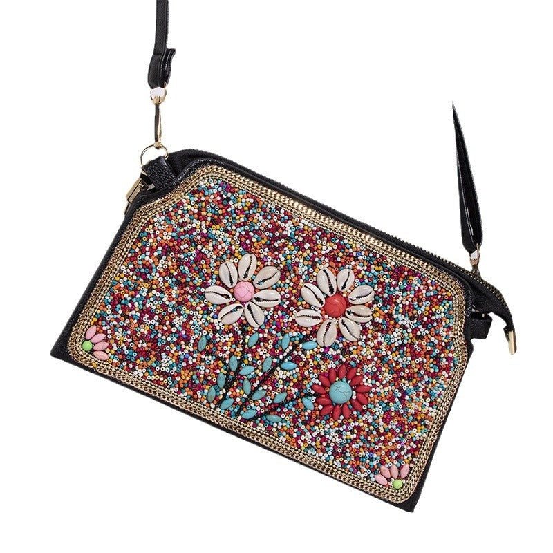 Embroidered crossbody bag with embellishments