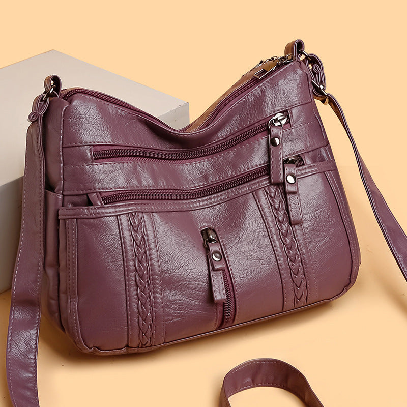 Multi-pocket shoulder bag with zipper closure
