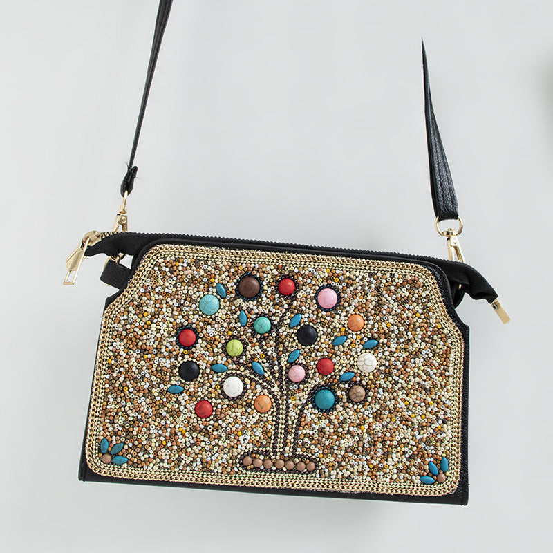 Embroidered crossbody bag with embellishments
