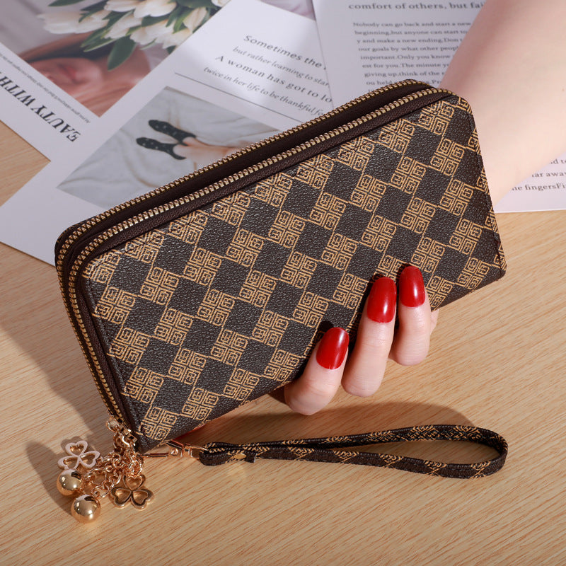 Patterned zip-around wallet with wrist strap