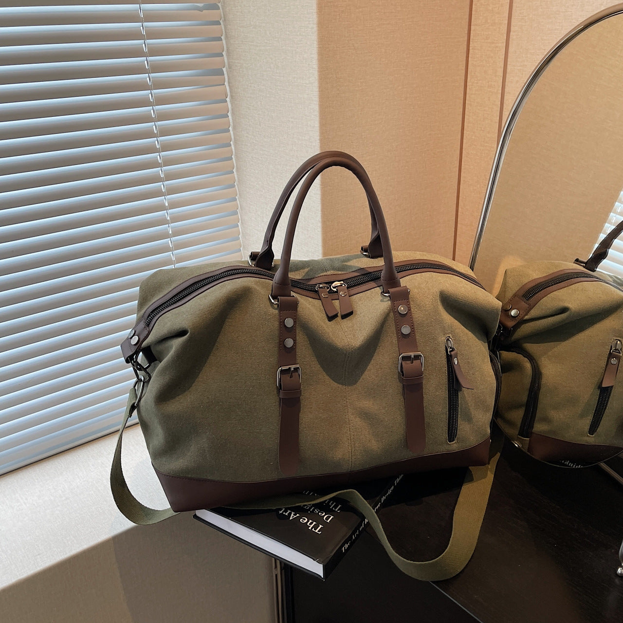 Canvas duffel bag with leather accents