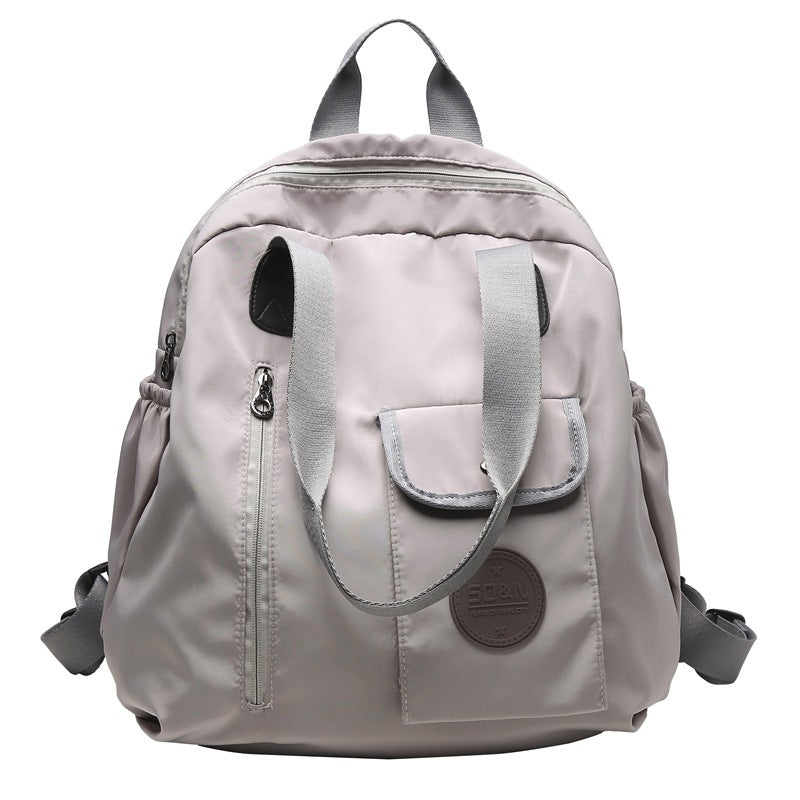 Soft backpack with flap and drawstring closure