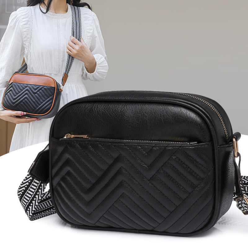 Quilted crossbody bag with front pocket