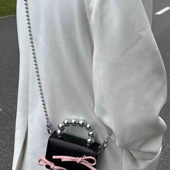 Mini handbag with bow and beaded handle