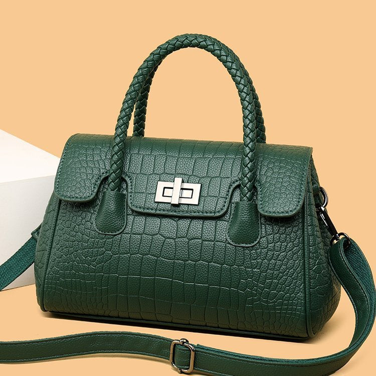 Embossed handbag with turn-lock closure