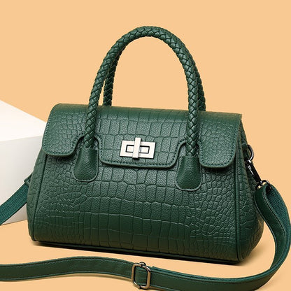 Embossed handbag with turn-lock closure