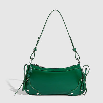 Glossy shoulder bag with side ties